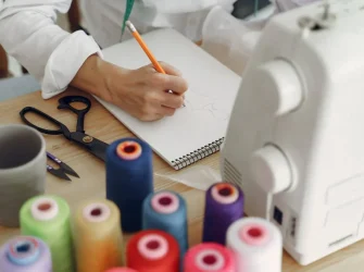 woman-sitting-studio-sew-cloth-scaled-1-1024x683
